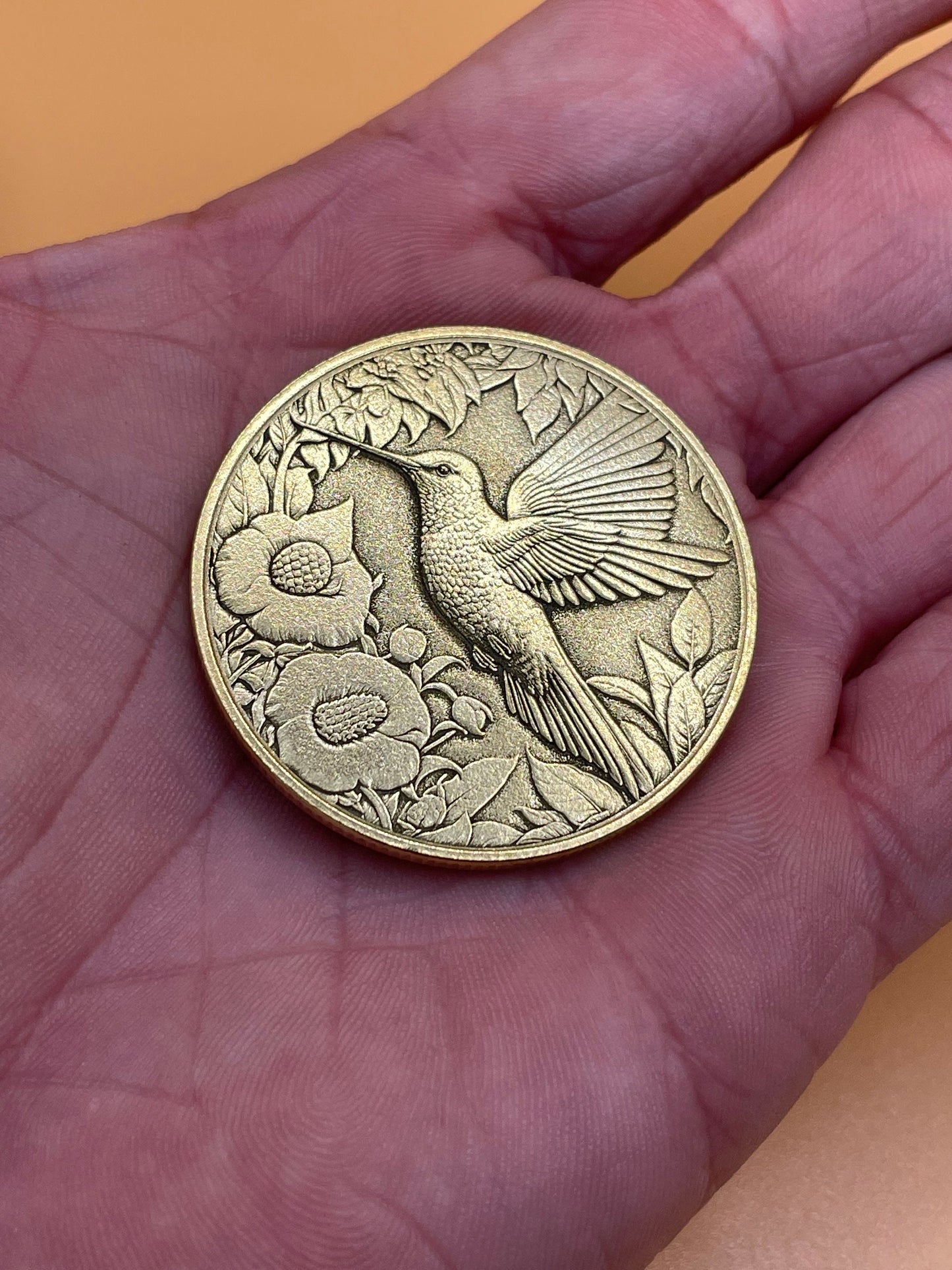 Graceful Flutter - Brass Coin with Hummingbird and Floral Delight
