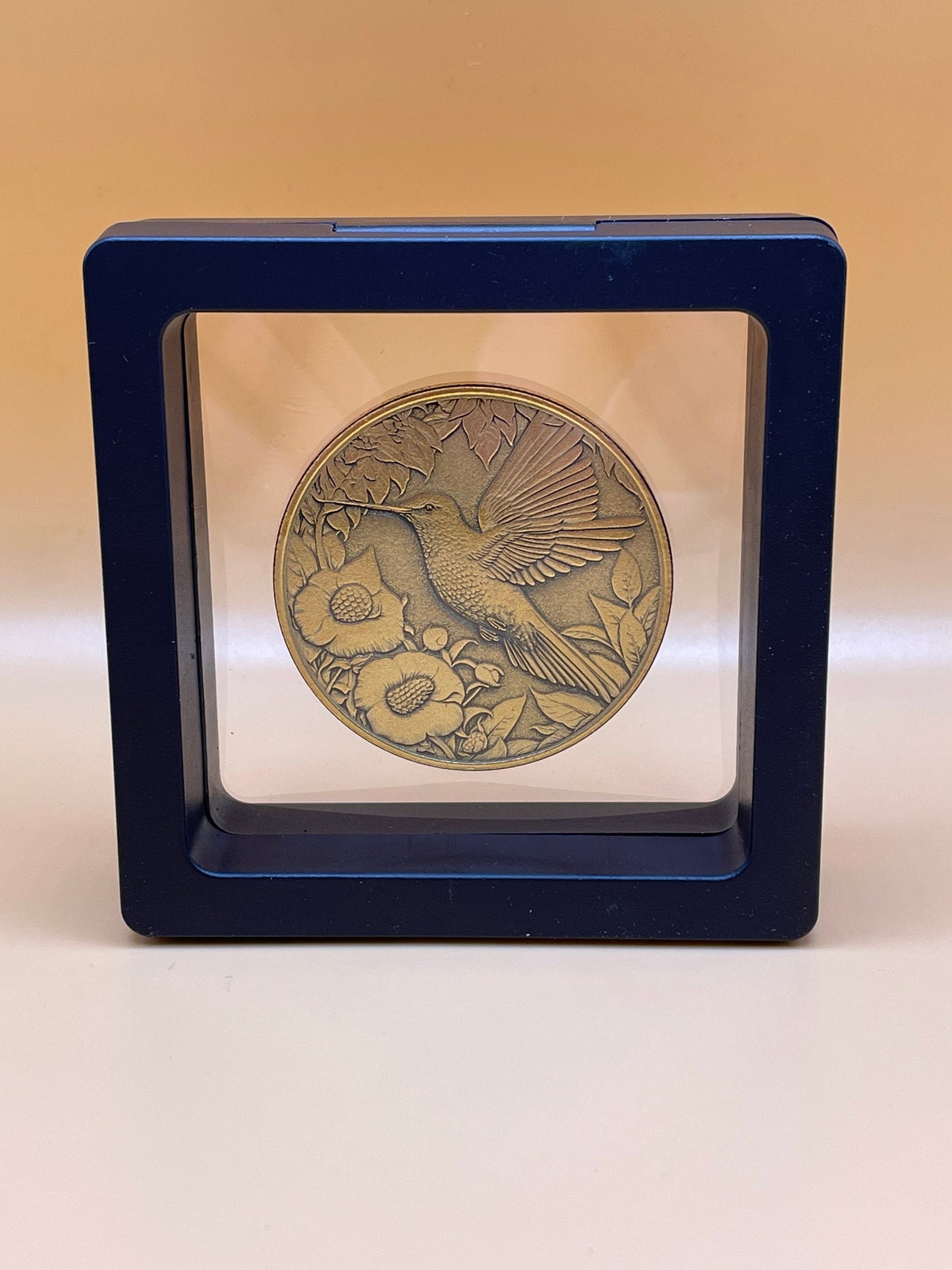 Graceful Flutter - Brass Coin with Hummingbird and Floral Delight